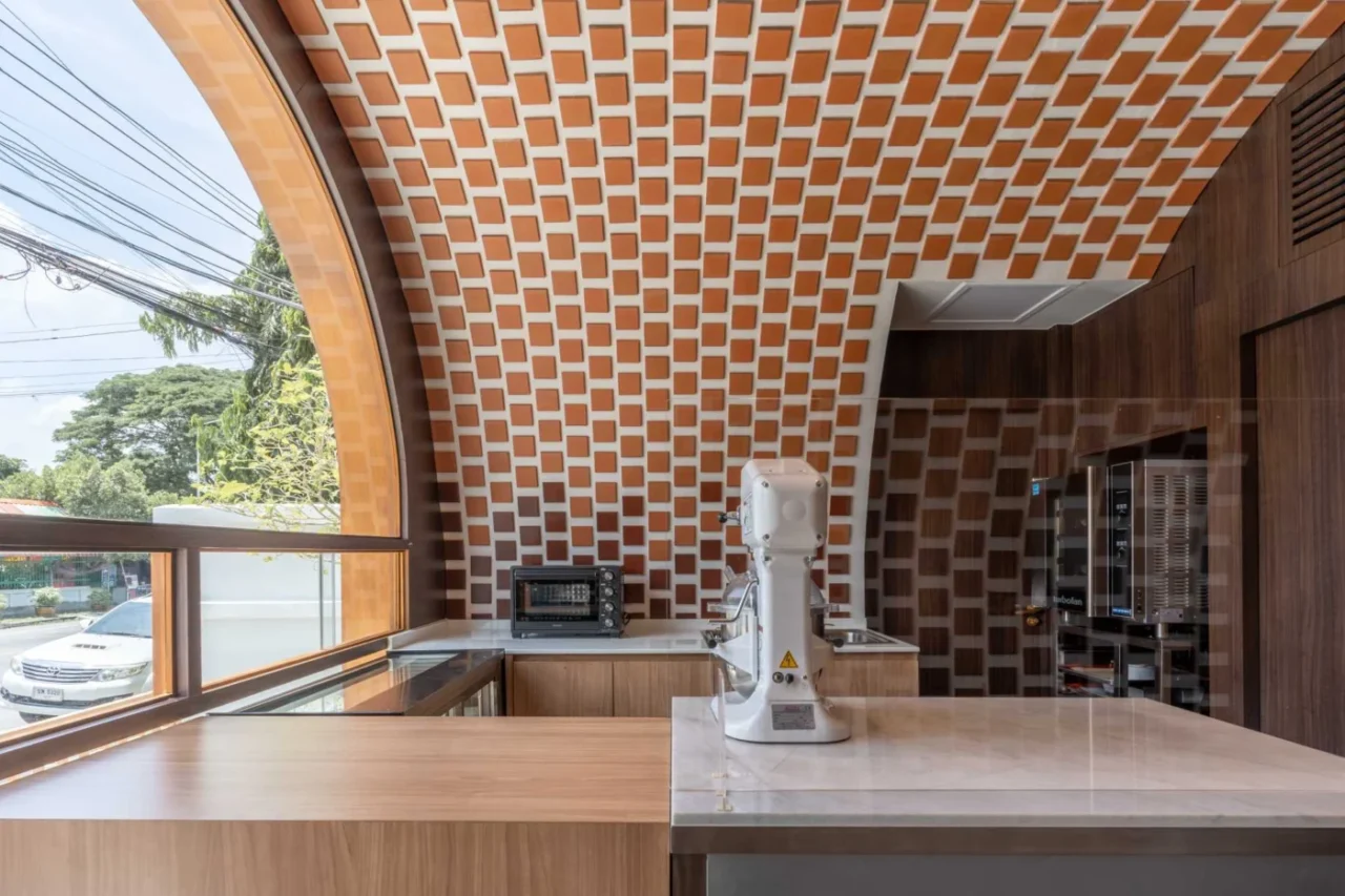Clay tile wall combined with contemporary fixtures inside the cafe