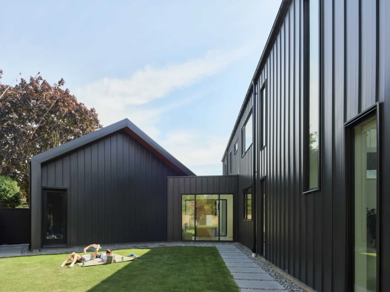 Barn-shaped house with black exterior siding