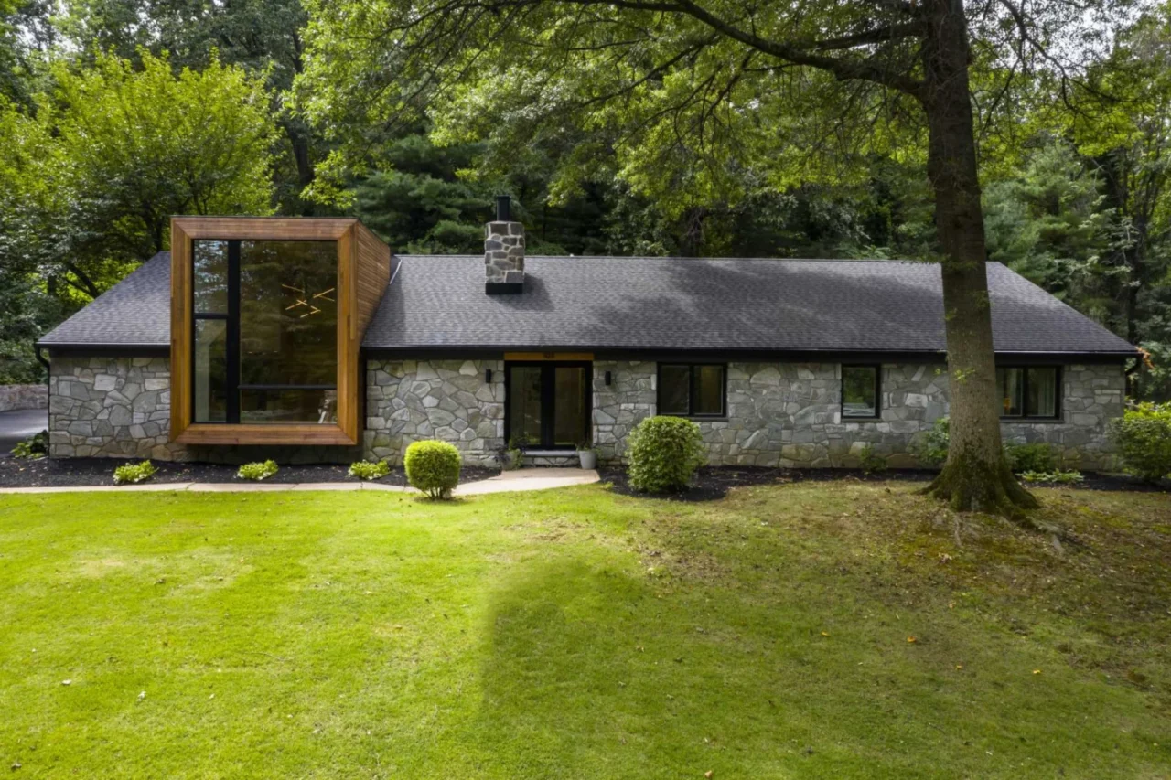 Retained stone walls next to new cedar cladding on the remodelled ranch home