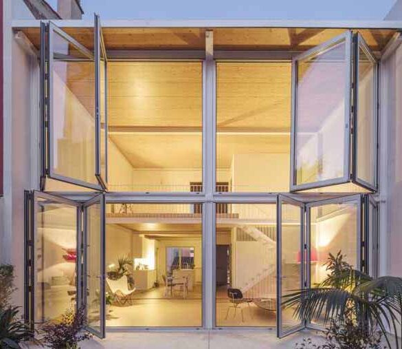 large-folding-glass-walls-open-this-home-to-a-courtyard