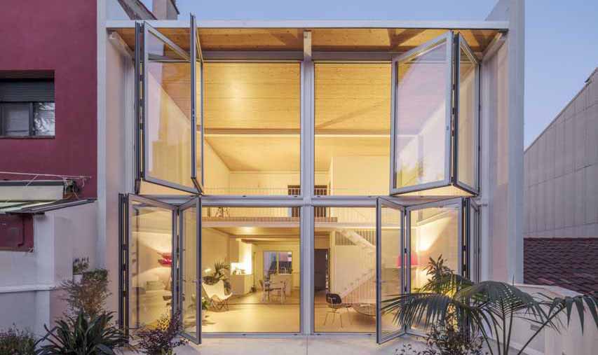 large-folding-glass-walls-open-this-home-to-a-courtyard