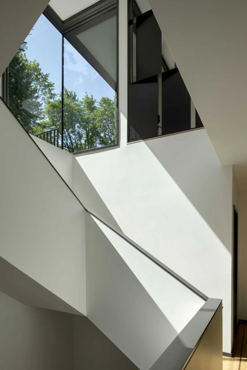 Stairs leading down from the sitting room to the main living level