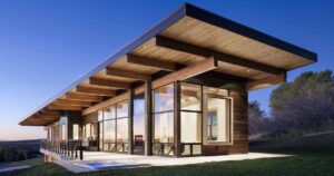 exterior-lighting-shows-off-the-post-and-beam-structure-of-this-home