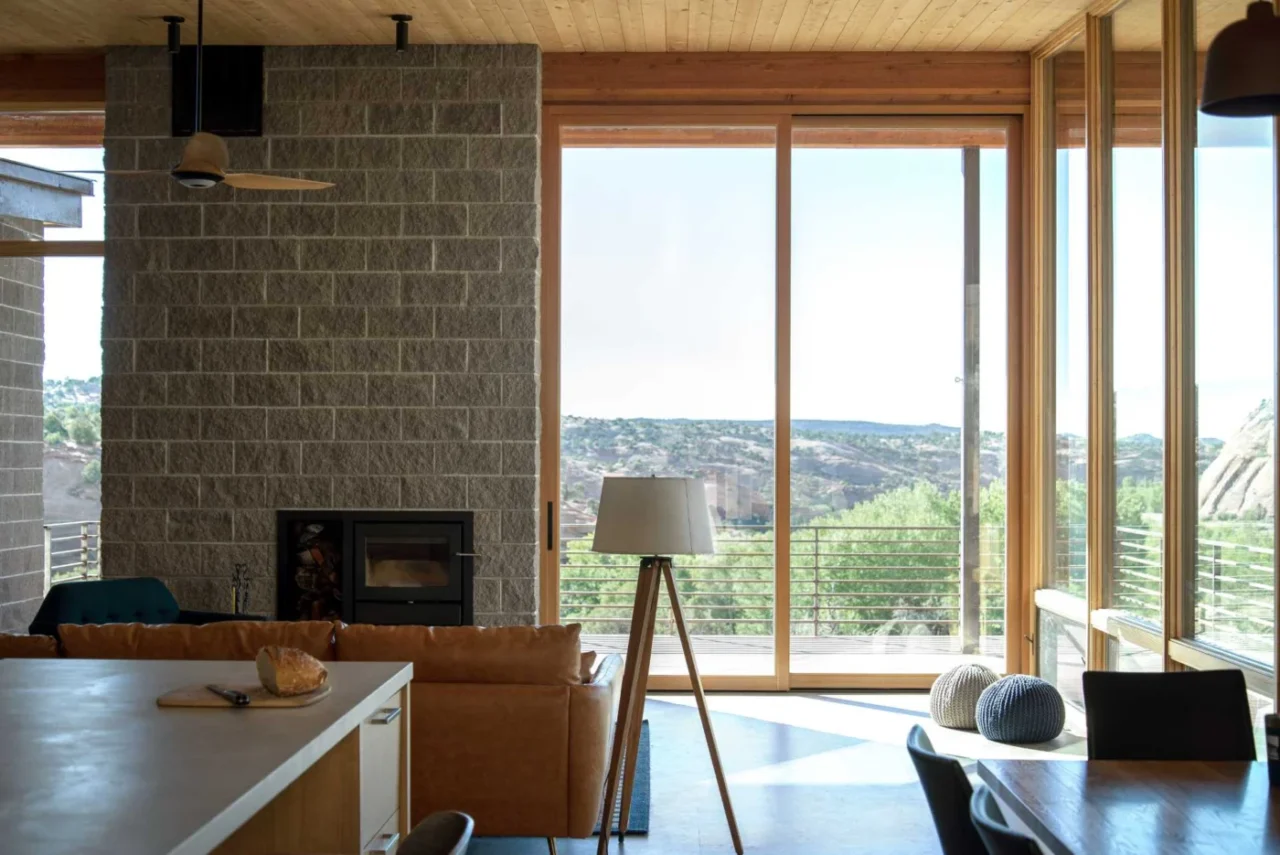 The weathering steel and cedar house within the Utah desert landscape