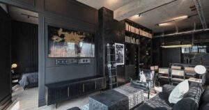 a-black-interior-gives-this-apartment-a-dark-and-dramatic-appearance
