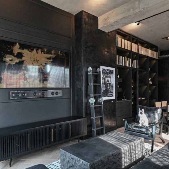 a-black-interior-gives-this-apartment-a-dark-and-dramatic-appearance