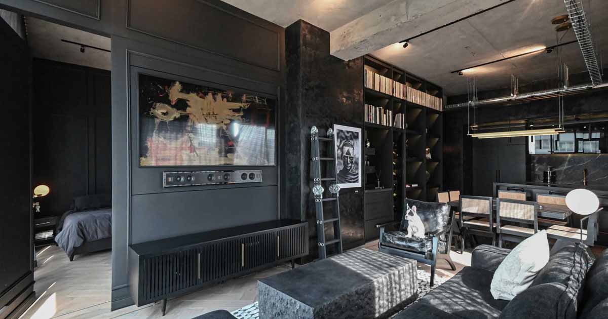 a-black-interior-gives-this-apartment-a-dark-and-dramatic-appearance