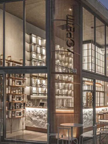 distillery-inspired-materials-are-featured-throughout-the-interior-of-this-gin-bar