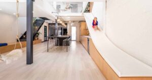 a-slide-is-a-fun-alternative-to-the-stairs-inside-this-home