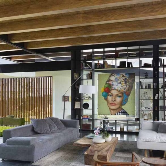 the-exposed-wood-ceiling-of-this-home-shows-off-its-structure