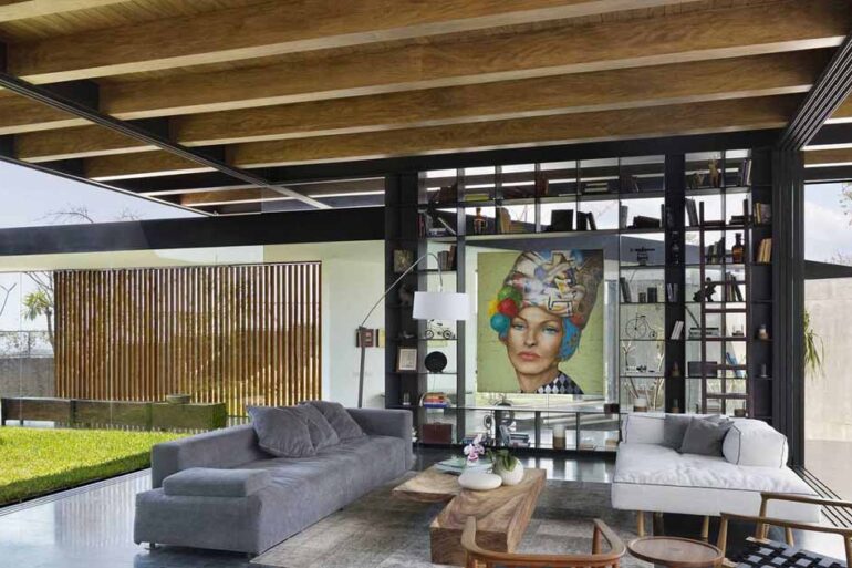 the-exposed-wood-ceiling-of-this-home-shows-off-its-structure