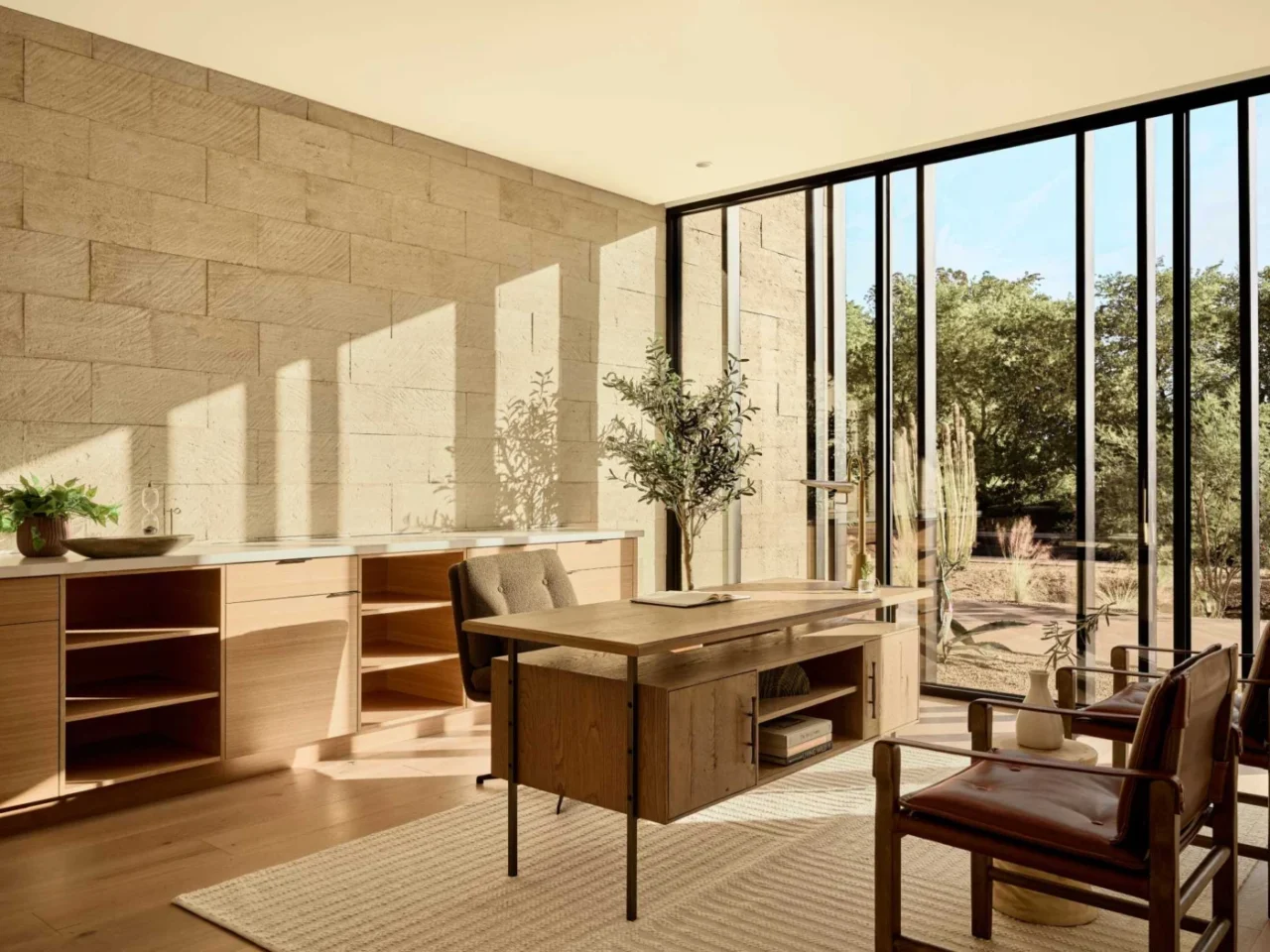 Home office with floor-to-ceiling windows facing the desert