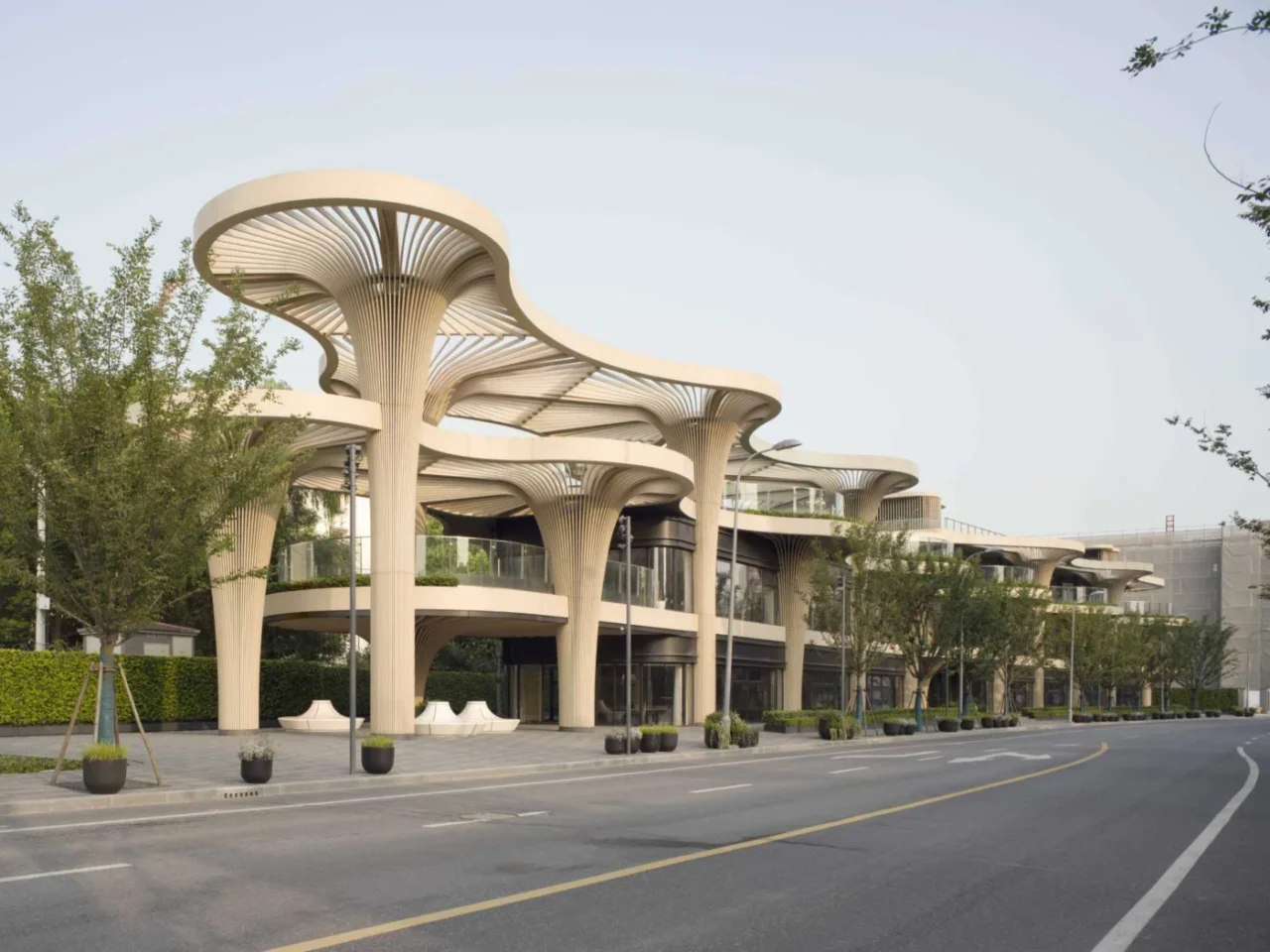 Solar Trees Marketplace in Shanghai, a retail building with tree-like columns and curved canopies along the street