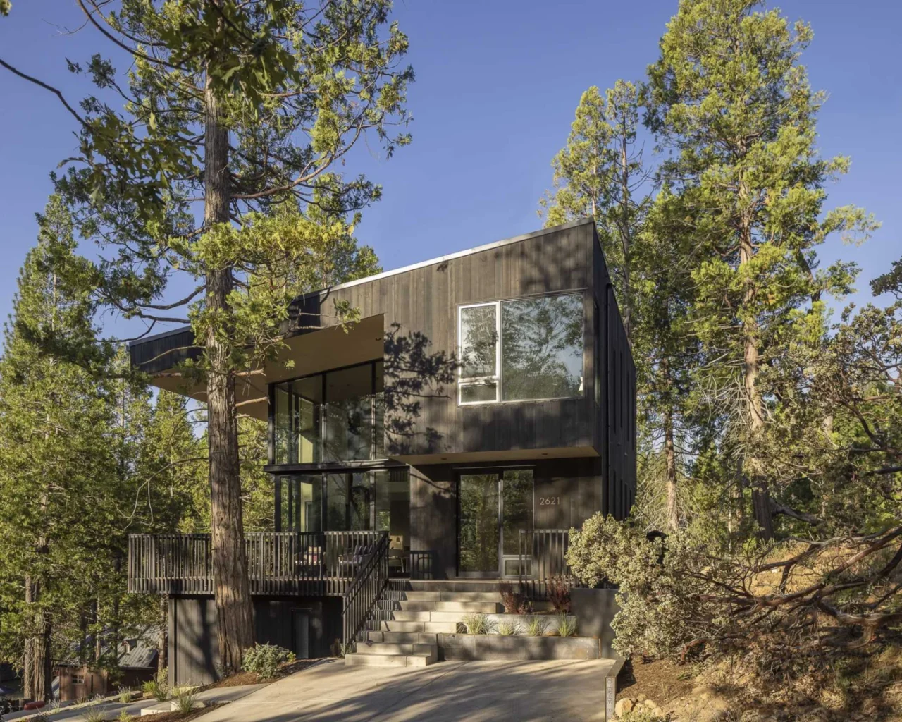 Dark wood exterior of the Wawona house by Prentiss + Balance + Wickline blending into the forest