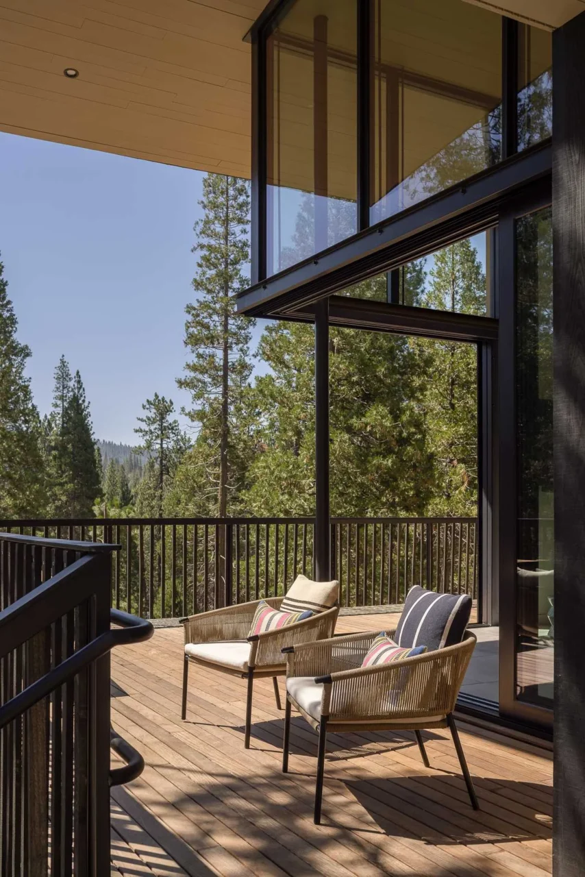 Deck around the house with spaced wood pickets open to the surrounding views