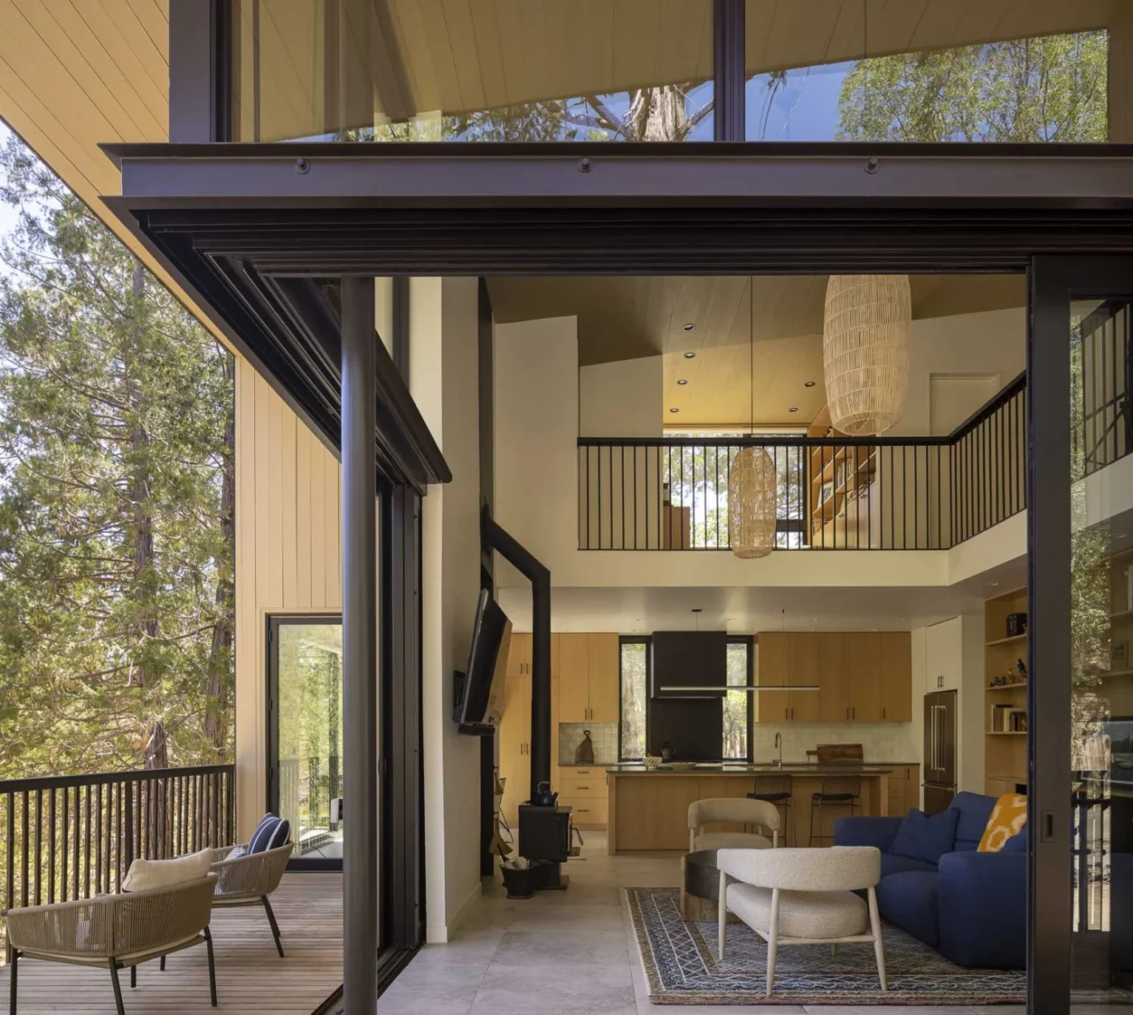 Living room with large sliding glass doors opening onto the deck