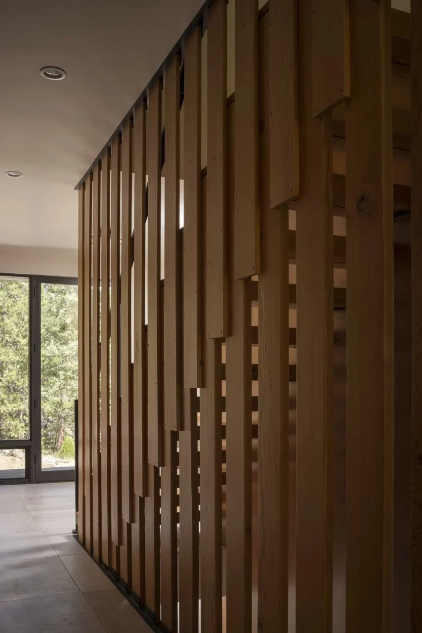 Staircase with thick reclaimed fir treads supported by overlapping vertical slats