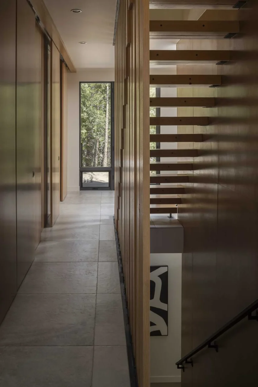 Reclaimed fir stair treads and slats echoing the vertical exterior siding