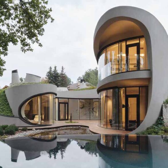 this-sculptural-home-is-full-of-curves-and-surrounded-by-landscaping