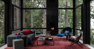 a-living-room-that-floats-above-the-forest-floor-is-a-remarkable-feature-of-this-home