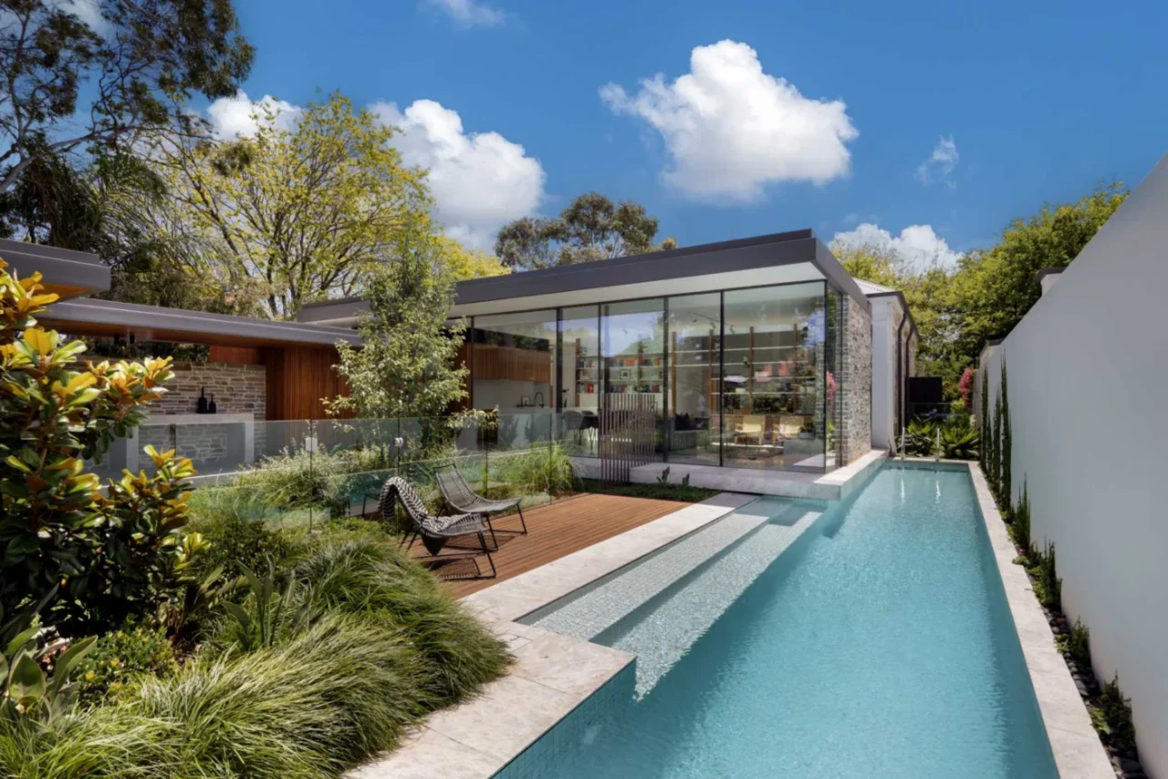 Extension by Glasshouse Projects to an 1890 sandstone cottage in Prospect, South Australia, with a pool