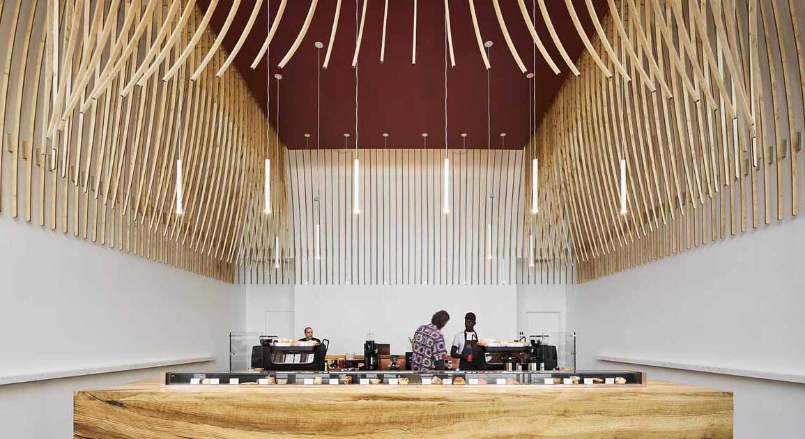 272-wood-slats-were-used-to-create-a-sculptural-element-inside-this-new-coffee-bar
