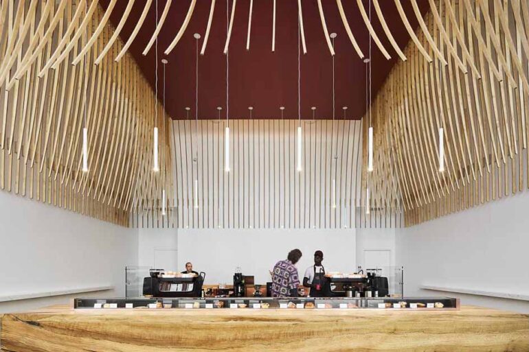 272-wood-slats-were-used-to-create-a-sculptural-element-inside-this-new-coffee-bar