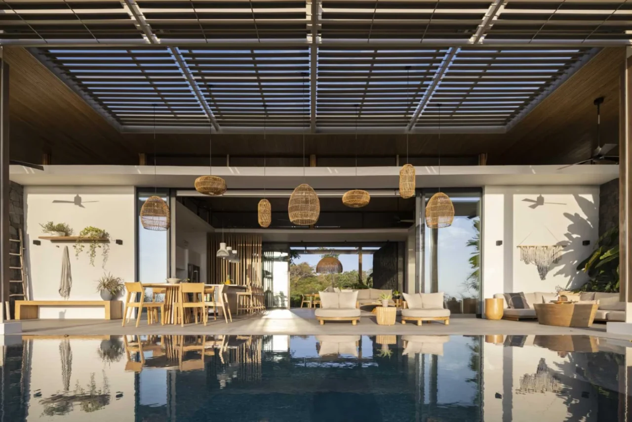 House in Costa Rica by Studio Saxe with large pergolas over the outdoor living areas