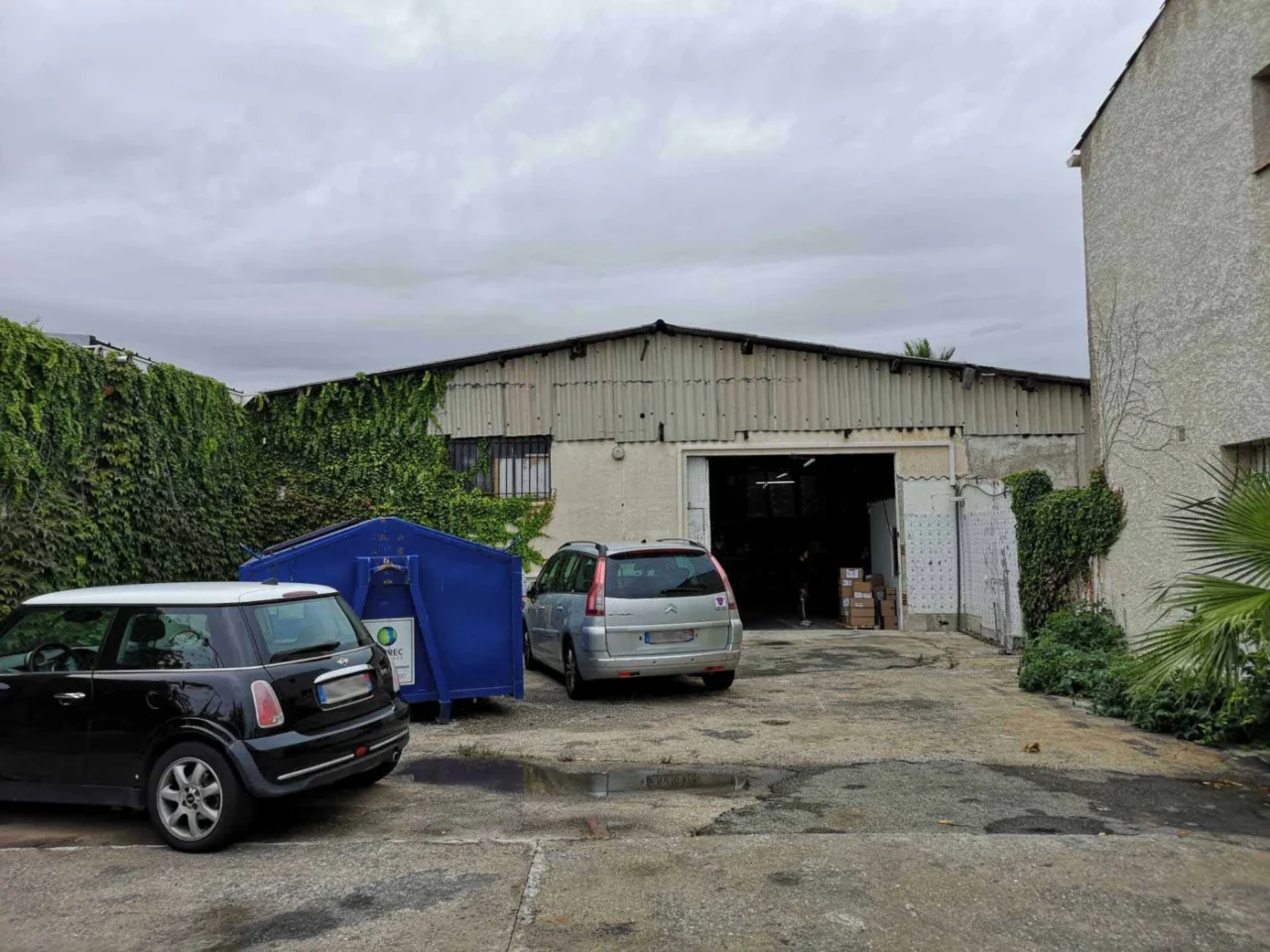Before: the dark, run-down warehouse still used for storage, before the conversion