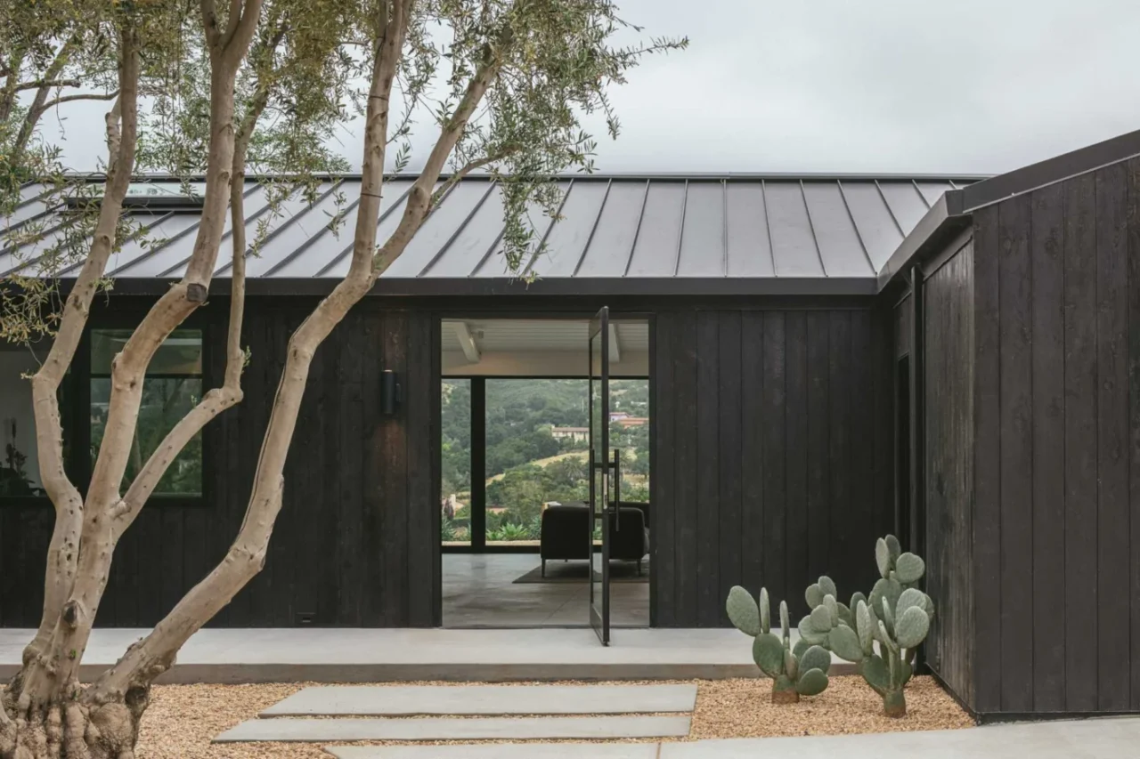 Charred cedar facade and standing-seam metal roof of the Montecito house
