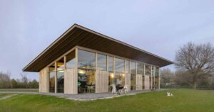 an-extended-sloped-roof-runs-the-length-of-this-modern-home
