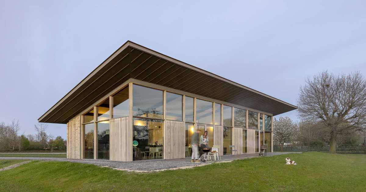 an-extended-sloped-roof-runs-the-length-of-this-modern-home