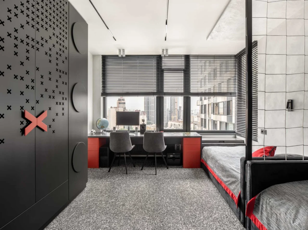 Kids’ bedroom furnished in black and red
