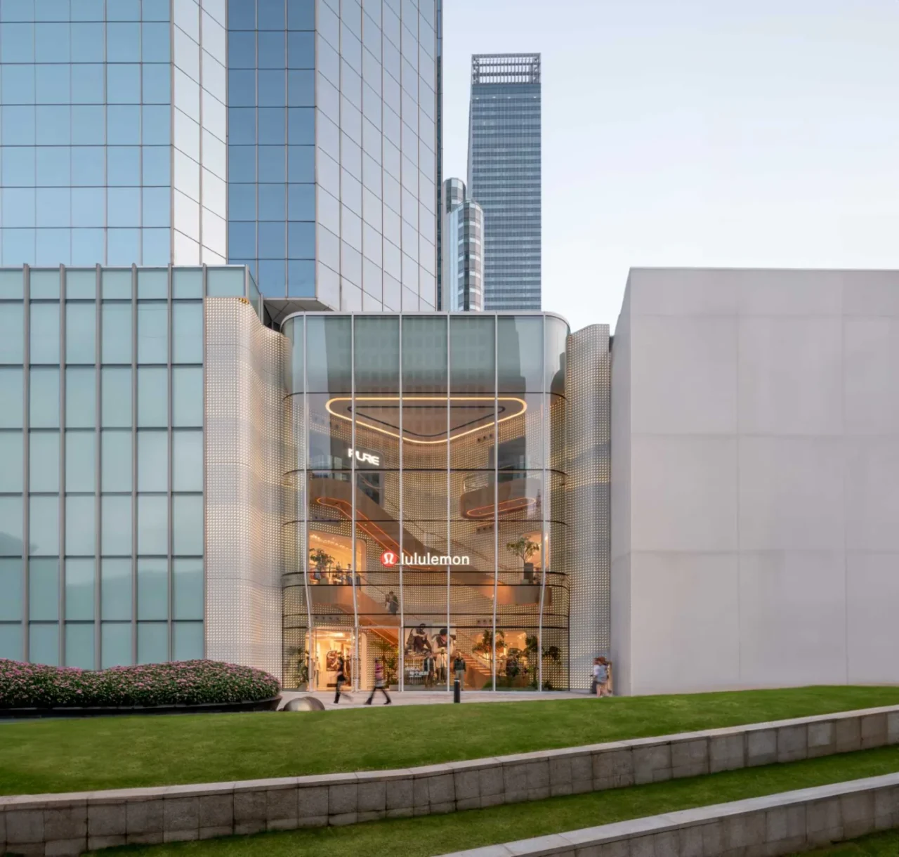Lululemon flagship store in Shanghai by AIM Architecture with a curved glass facade