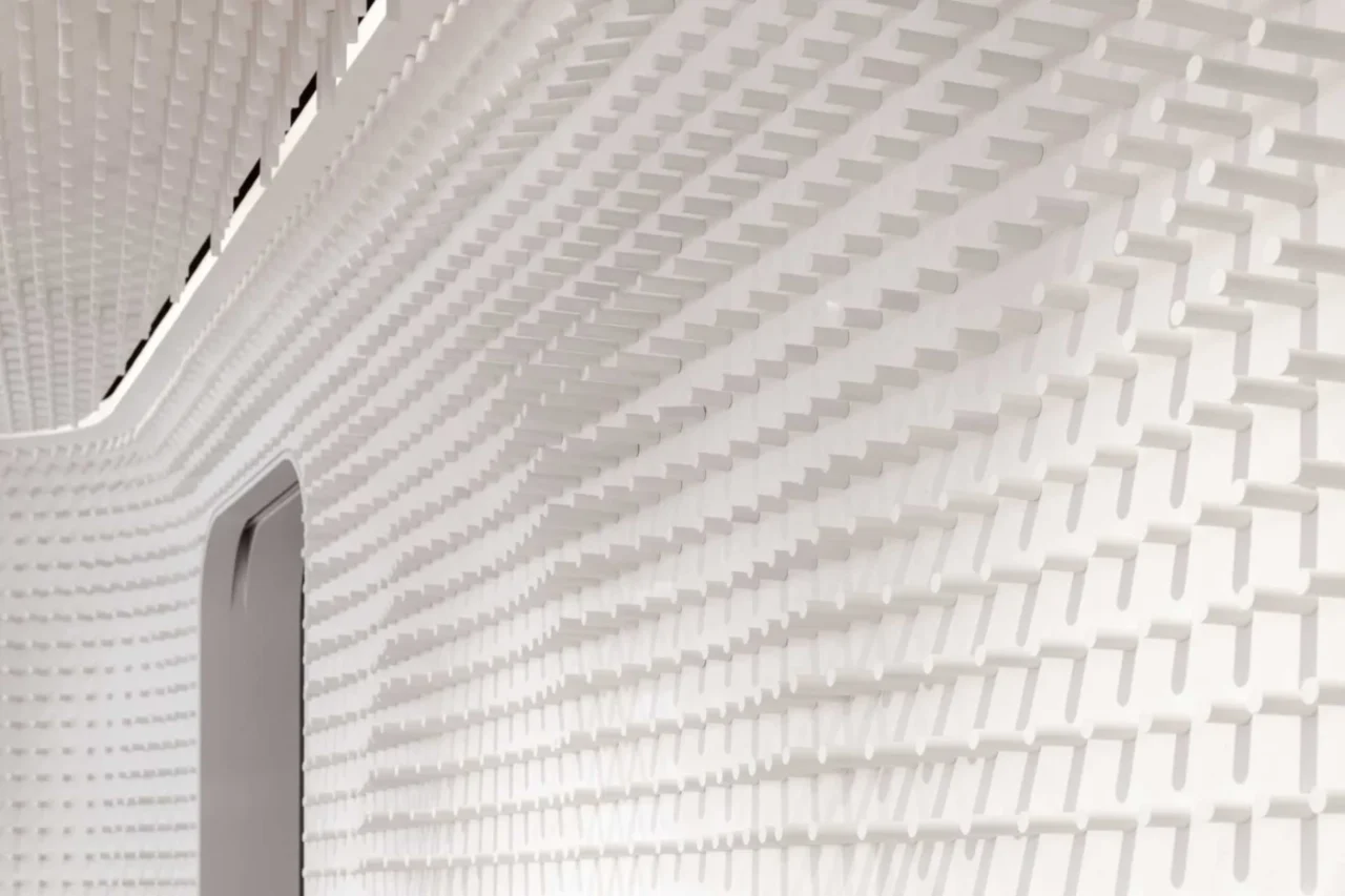 Close view of the extruded pattern lining the curving walls