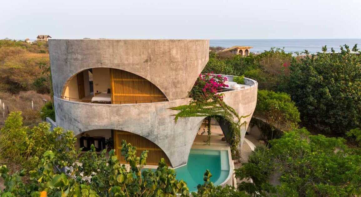 a-round-design-and-open-arches-give-this-concrete-home-a-unique-look