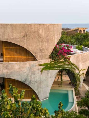 a-round-design-and-open-arches-give-this-concrete-home-a-unique-look