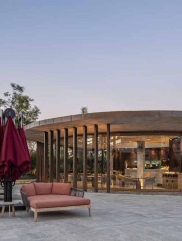 a-concrete-ceiling-floats-above-this-round-hotel-bar