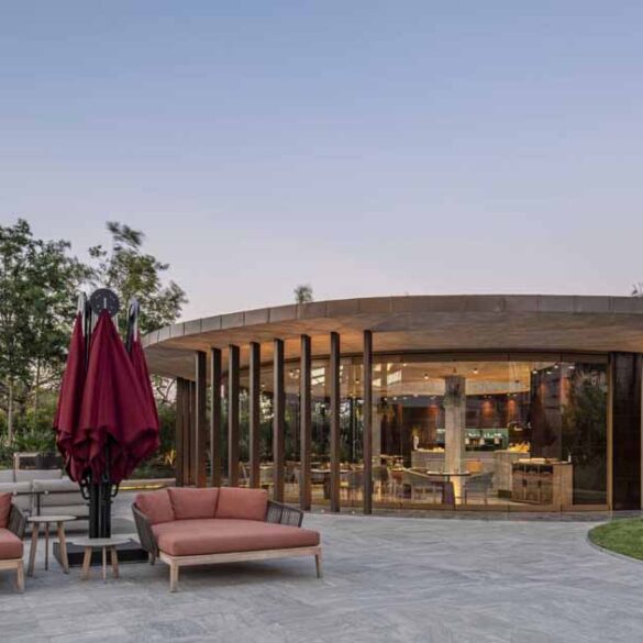 a-concrete-ceiling-floats-above-this-round-hotel-bar