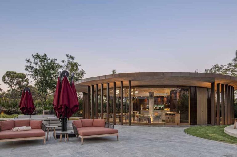 a-concrete-ceiling-floats-above-this-round-hotel-bar