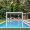 a-pool-house-and-loggia-enhance-this-lush-backyard-experience
