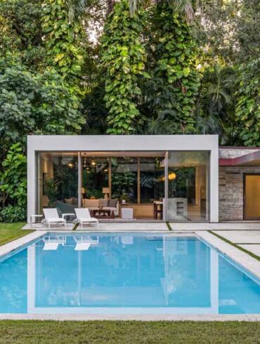 a-pool-house-and-loggia-enhance-this-lush-backyard-experience