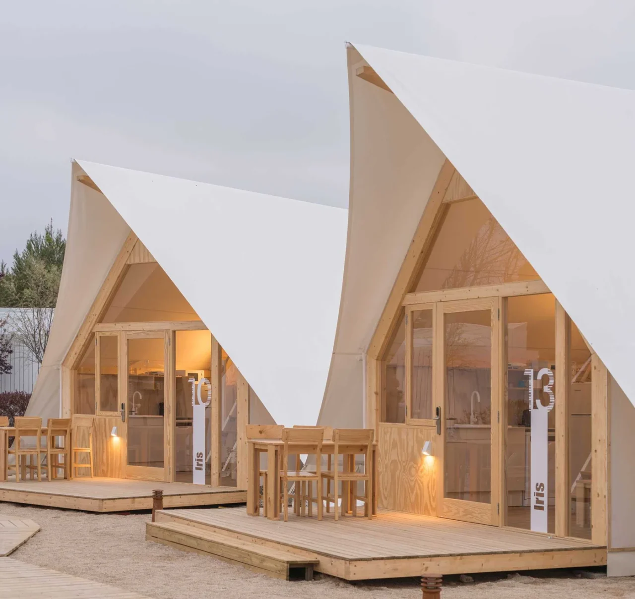 White tarpaulins and light pine wood of the glamping tent