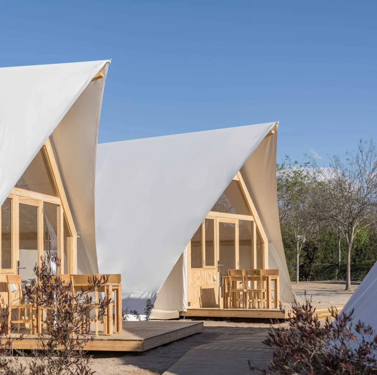Front facade of the tent in sanded pine wood and glass