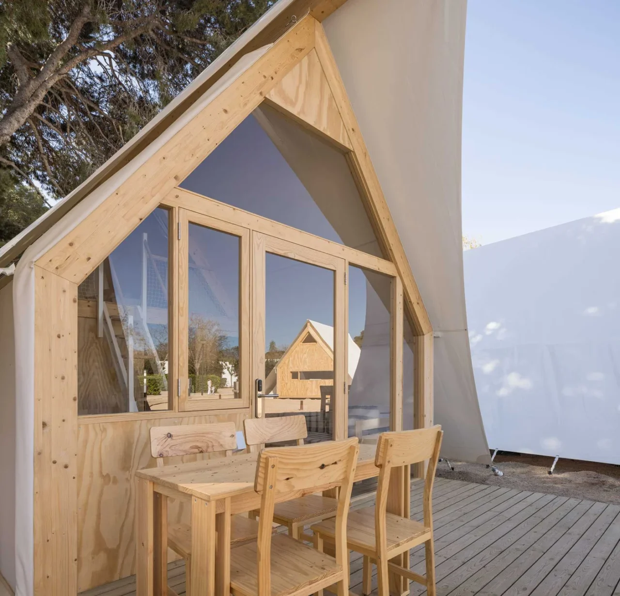 TipiTop tent with a timber structure, windows and white exterior