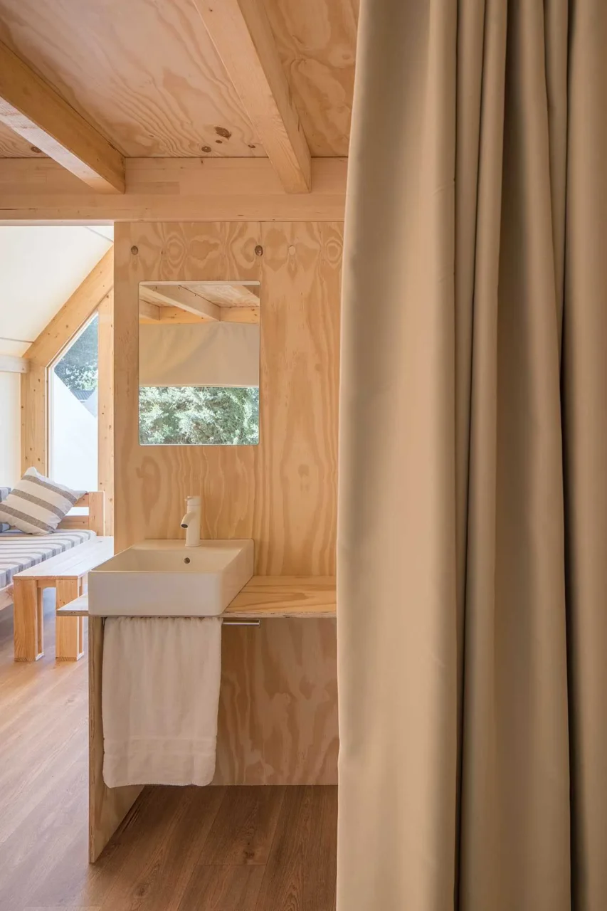 Simple stairs up to the loft bedroom inside the tent