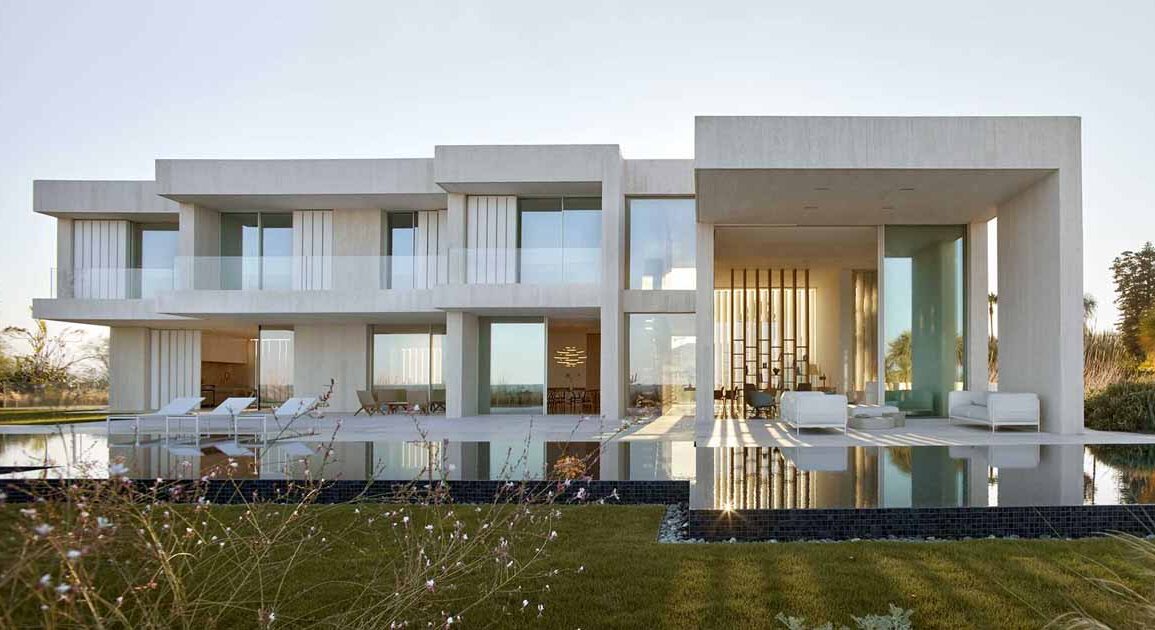 a-white-concrete-exterior-protects-this-seaside-mediterranean-house