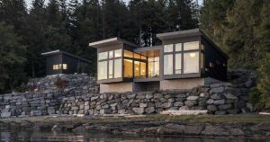 a-new-home-overhanging-the-water's-edge-in-alaska