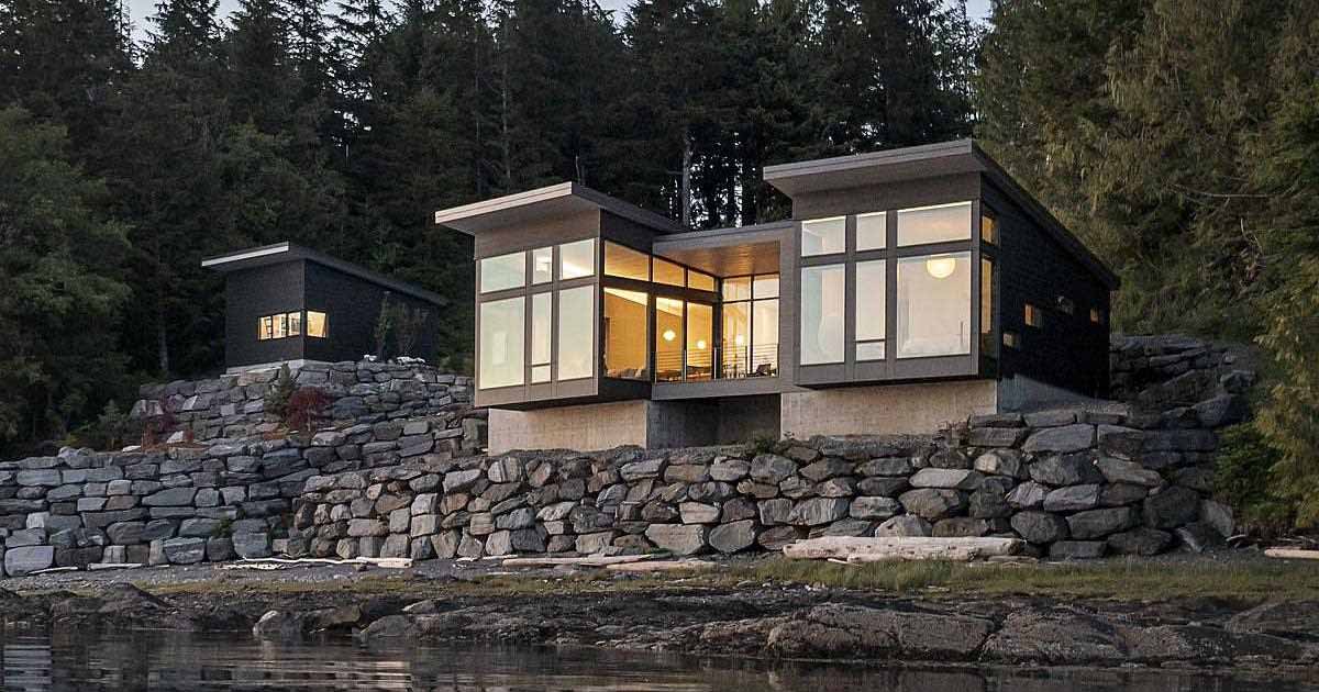 a-new-home-overhanging-the-water's-edge-in-alaska