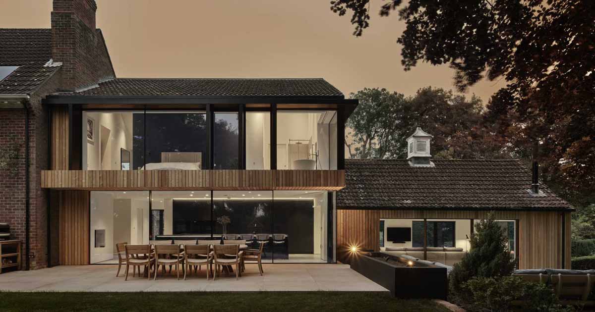 an-old-brick-home-received-a-modern-wood-clad-extension